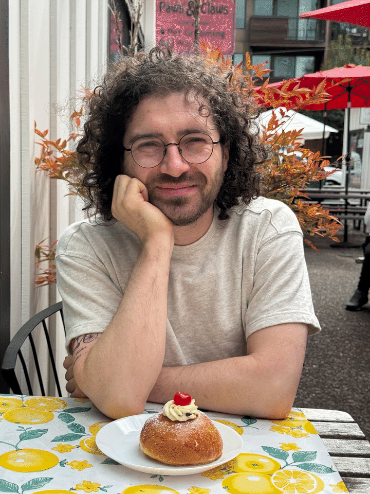 Adam Fishman at a café, with animated computer vision annotations.